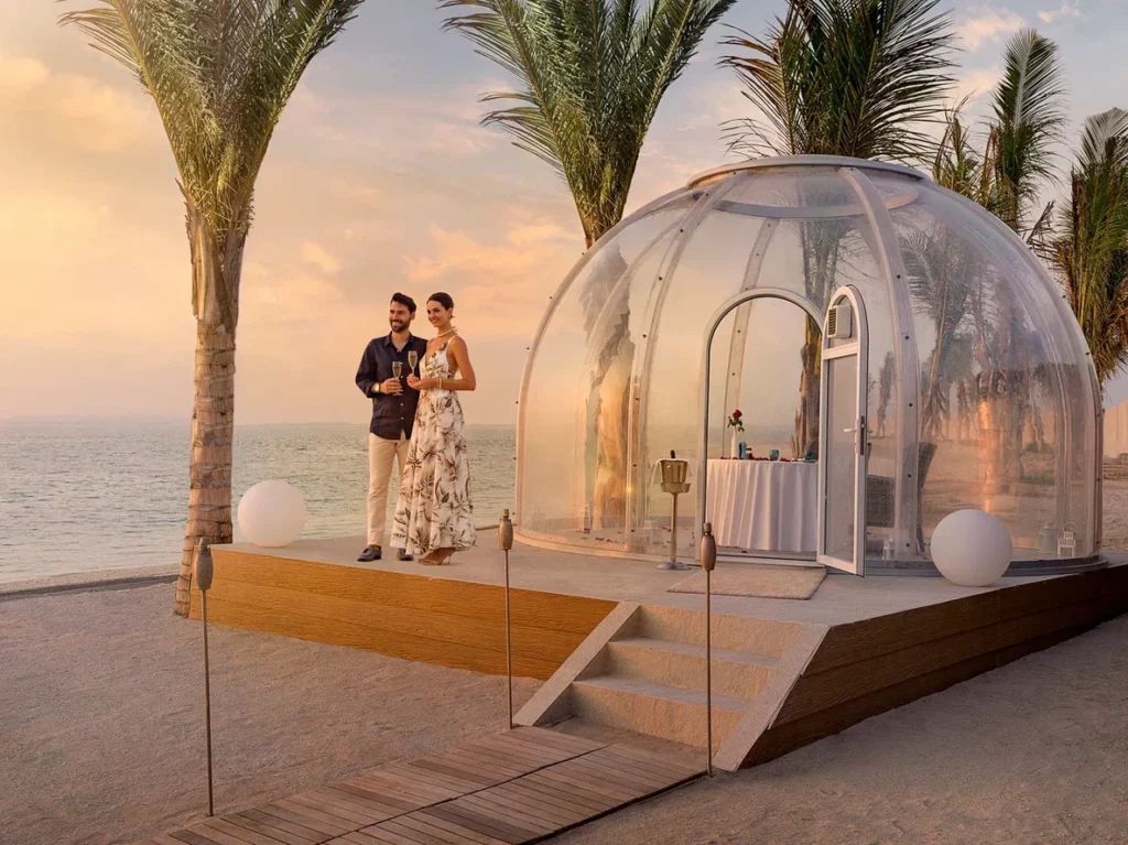 Anantara World Islands Dubai Exterior View Couple Bubble Dining Sunset 2